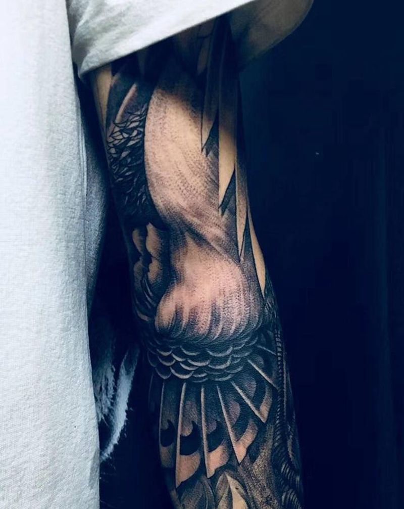 磐涅纹身图片_手臂点刺甩针凤凰纹身图案