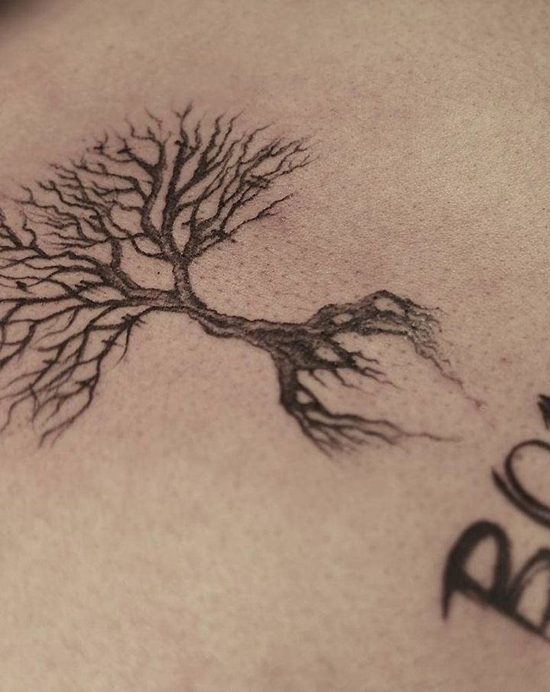 源纹身图片_胸部点刺几何树纹身图案