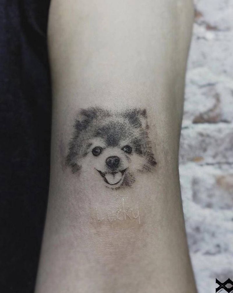 可爱的小狗纹身图片_手臂欧美写实纹身图案