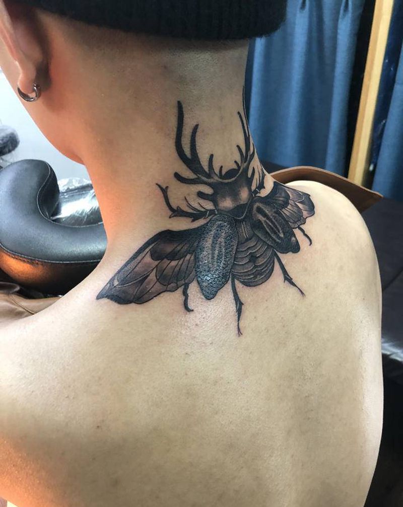 甲虫纹身图片_颈部点刺纹身图案