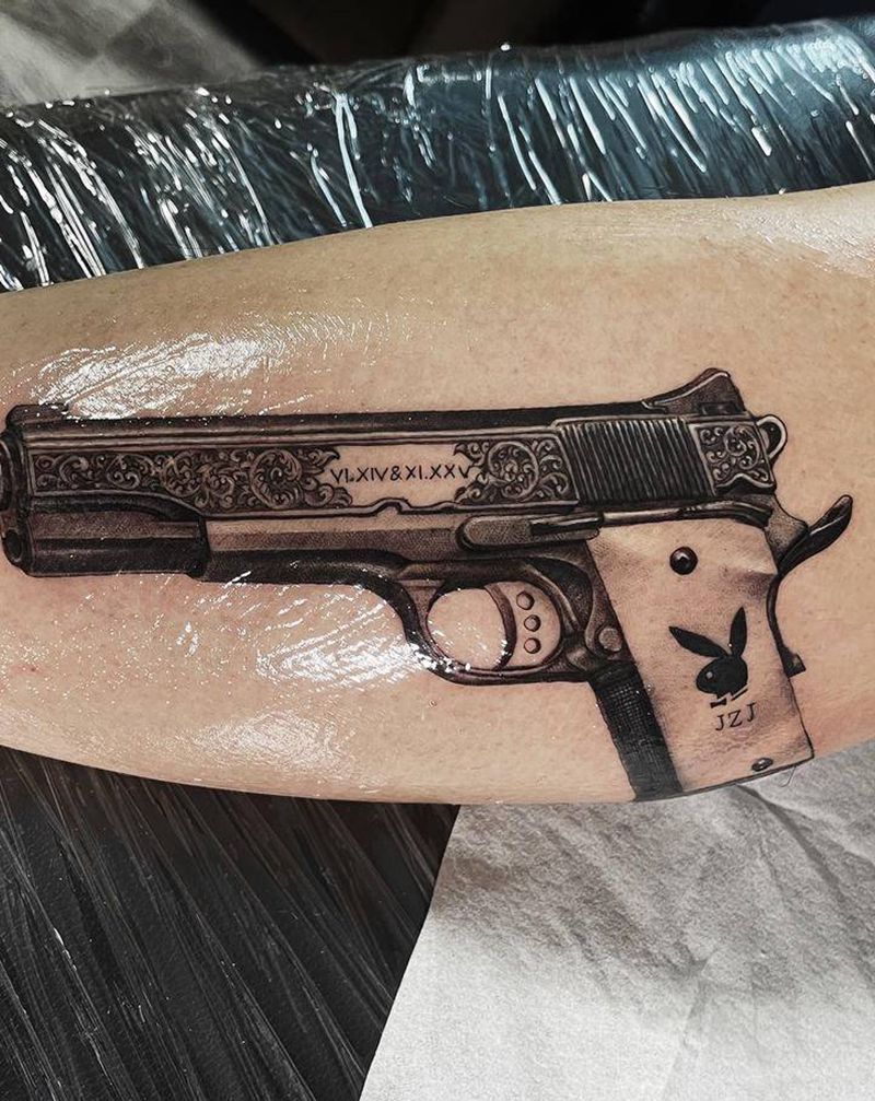 1911纹身图片_腿部欧美写实枪纹身图案