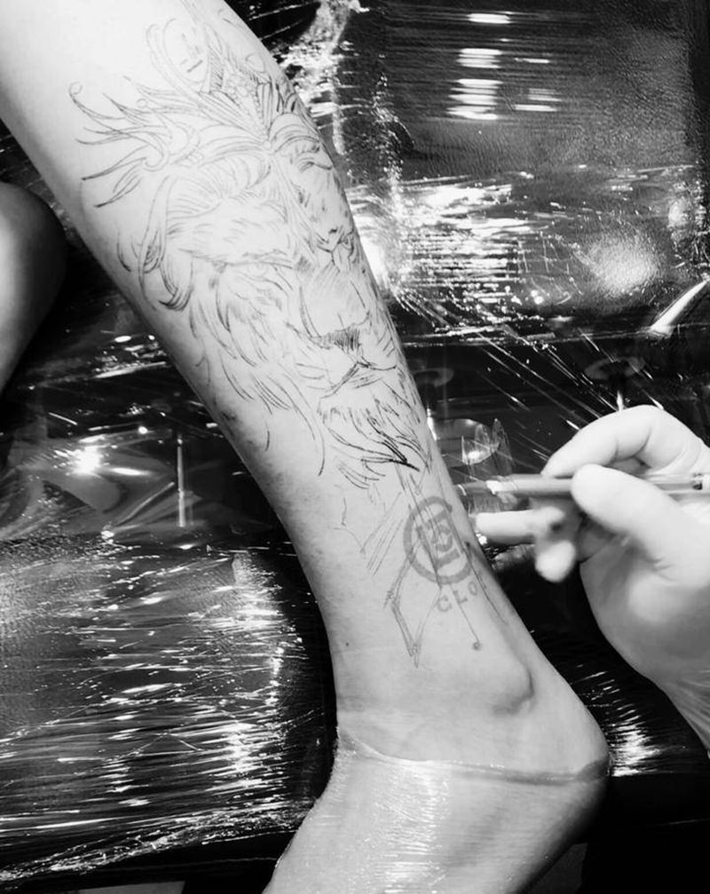 狮子纹身图片_腿部欧美写实纹身图案