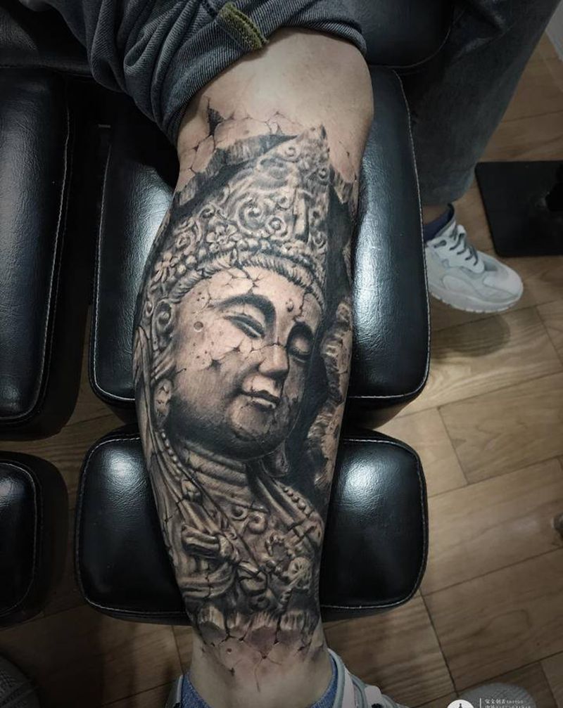 石雕佛纹身图片_腿部纹身图案