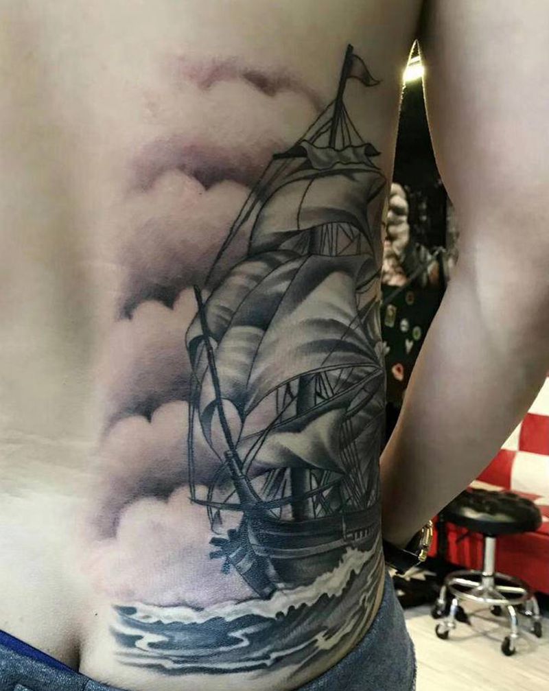 乘风破浪纹身图片_腰部纹身图案