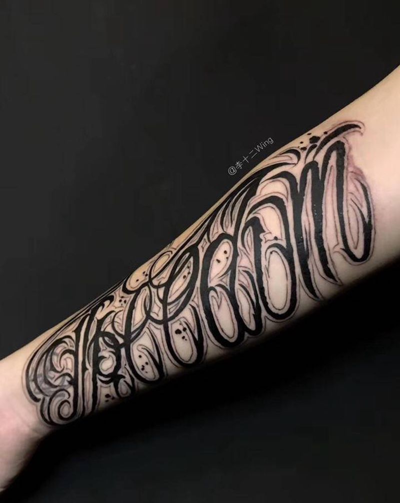 Freedom-自由纹身图片_手臂花体字纹身图案