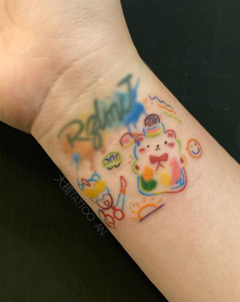 汽水糖纹身图片_手臂纹身图案