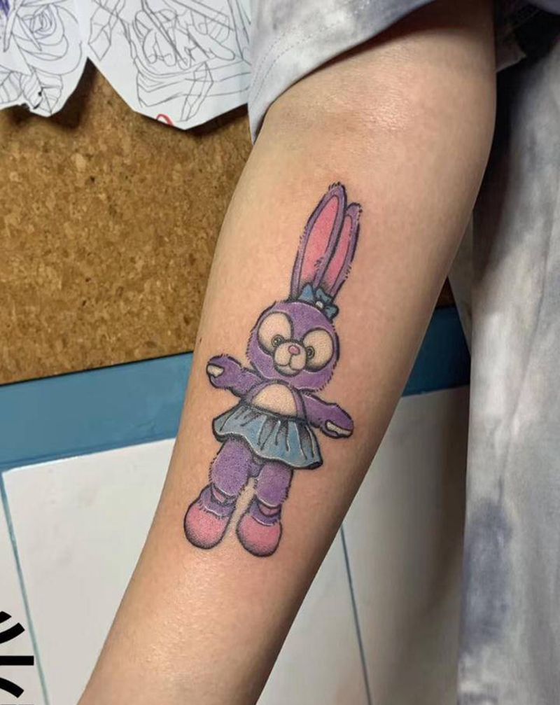兔娃娃卡通纹身图片_手臂纹身图案