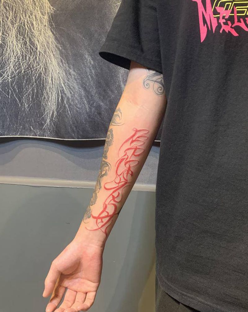 DNLM纹身图片_手臂花体字纹身图案