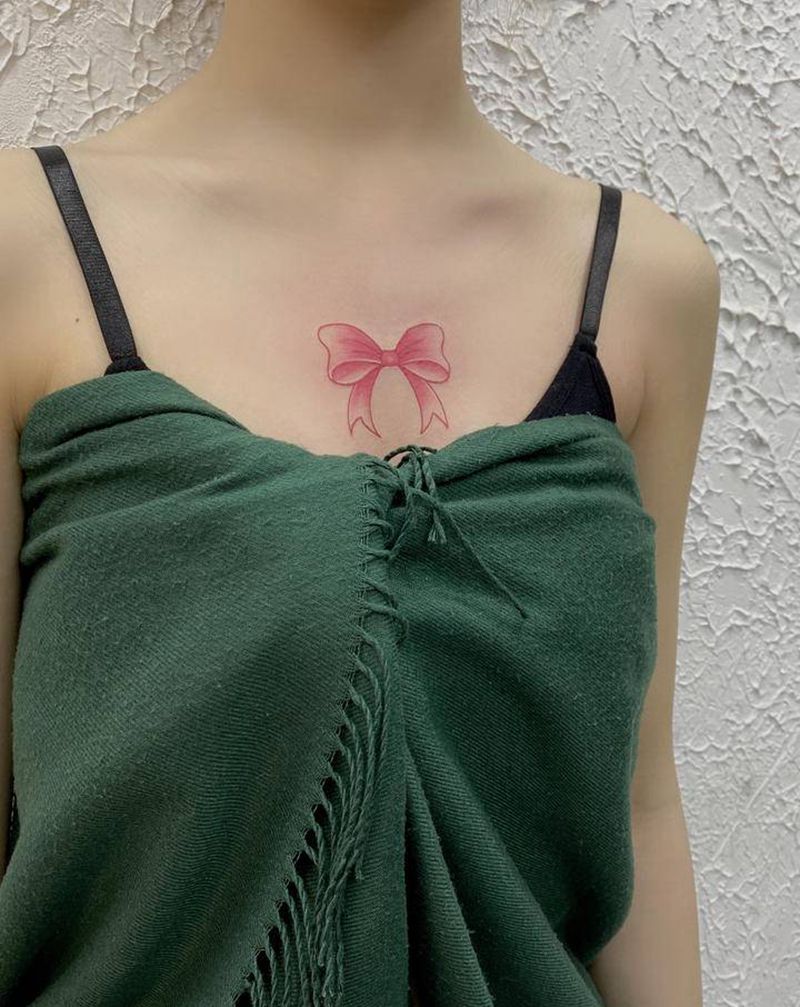 胸口蝴蝶结纹身纹身图片_胸部蝴蝶结纹身图案