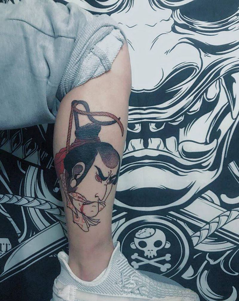 生首纹身图片_腿部老传统纹身图案