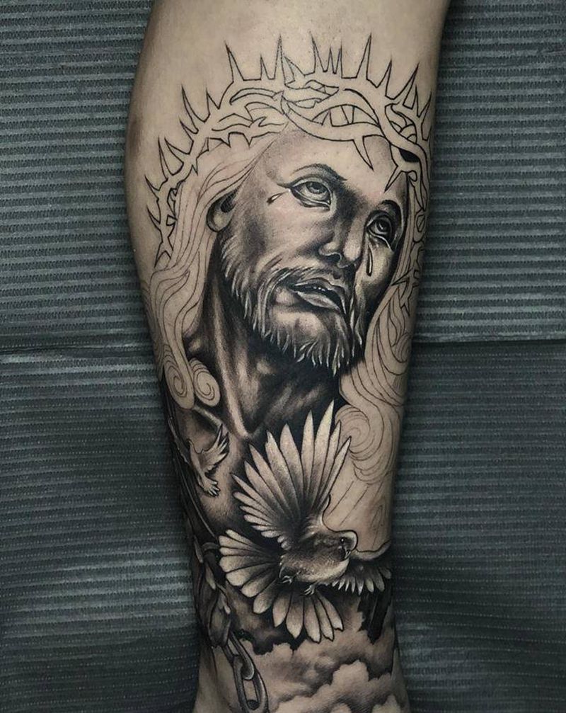 耶稣纹身图片_腿部欧美写实纹身图案