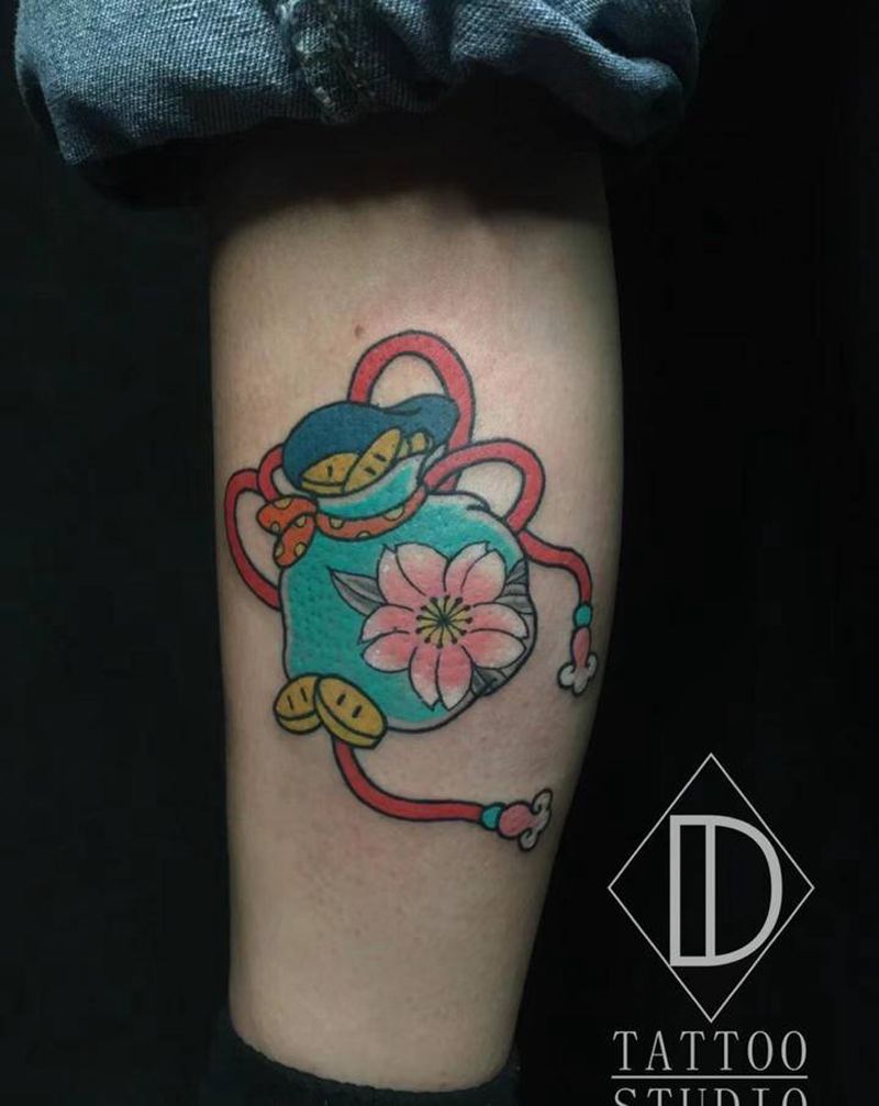 传统钱袋纹身图片_腿部老传统新传统钱袋福袋纹身图案