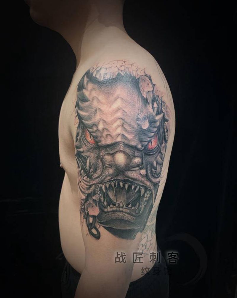 龙威—挣脱纹身图片_手臂纹身图案