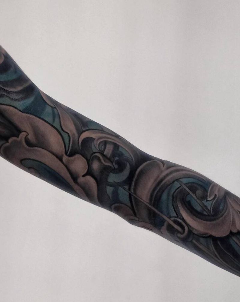 唐草花臂纹身图片_手臂新传统几何纹身图案