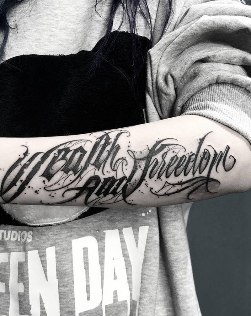 Wealth and Free纹身图片_花体字纹身图案