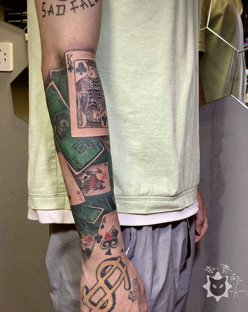 钞票.扑克牌纹身图片_手臂手部欧美写实美元扑克牌纹身图案