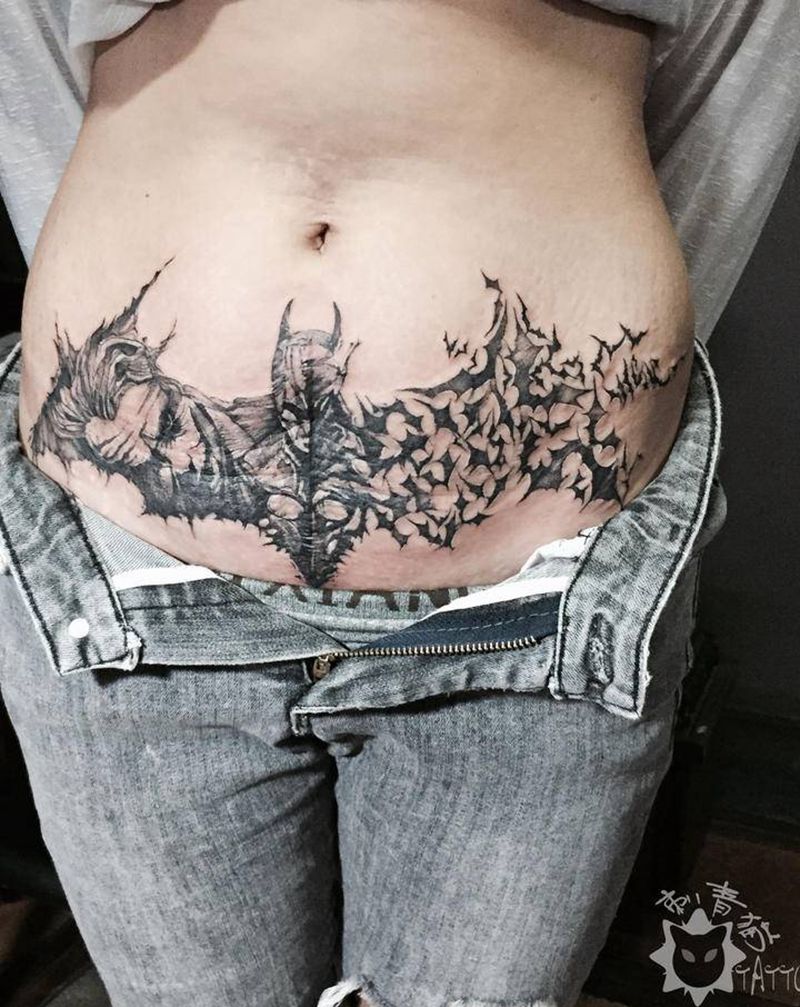 蝙蝠侠小丑纹身图片_腹部腰部点刺小丑刨腹产蝙蝠侠纹身图案