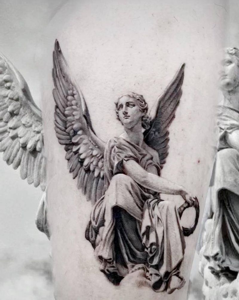 天使雕塑纹身图片_腿部欧美写实纹身图案