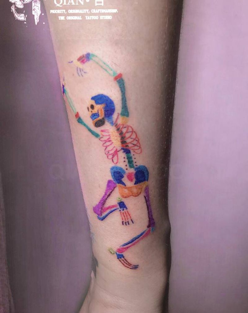 骷髅也可爱纹身图片_手臂纹身图案