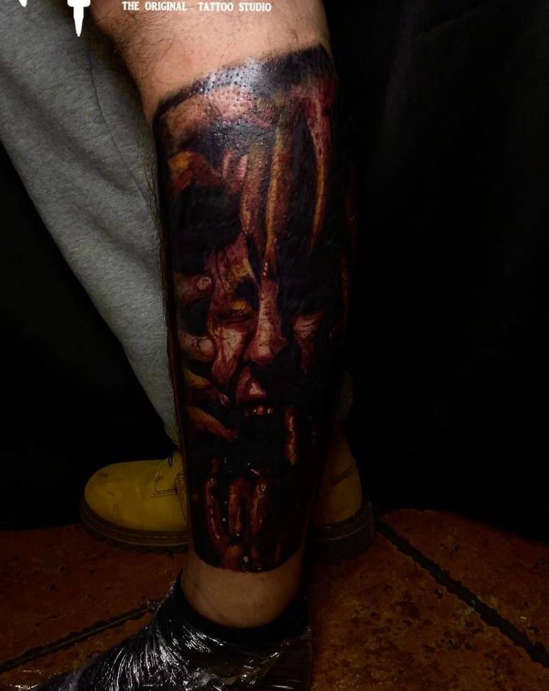 血腥恐怖纹身图片_腿部欧美写实血腥恐怖纹身图案