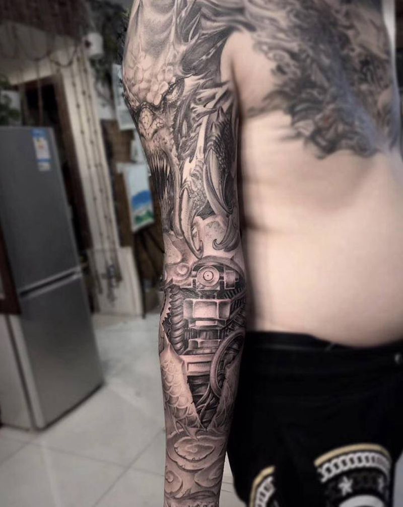 机械臂纹身图片_手臂欧美写实机械石雕龙威纹身图案