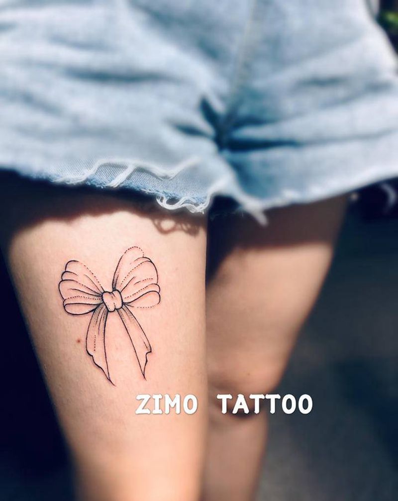 蝴蝶结纹身图片_腿部点刺纹身图案