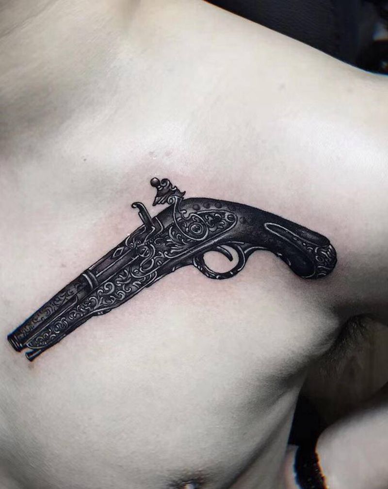 火枪纹身图片_胸部肩部欧美写实纹身图案