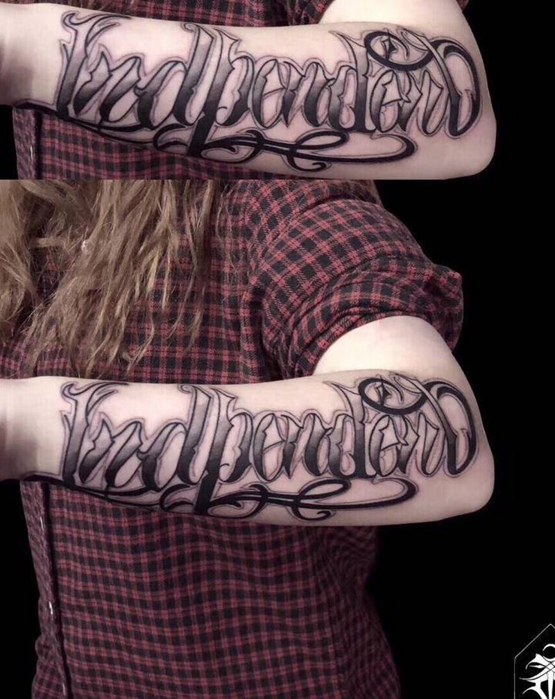 ⚜️纹身图片_手臂花体字花体奇卡诺西海岸纹身图案