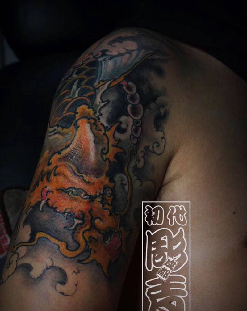 龙鱼遮盖纹身图片_手臂纹身图案