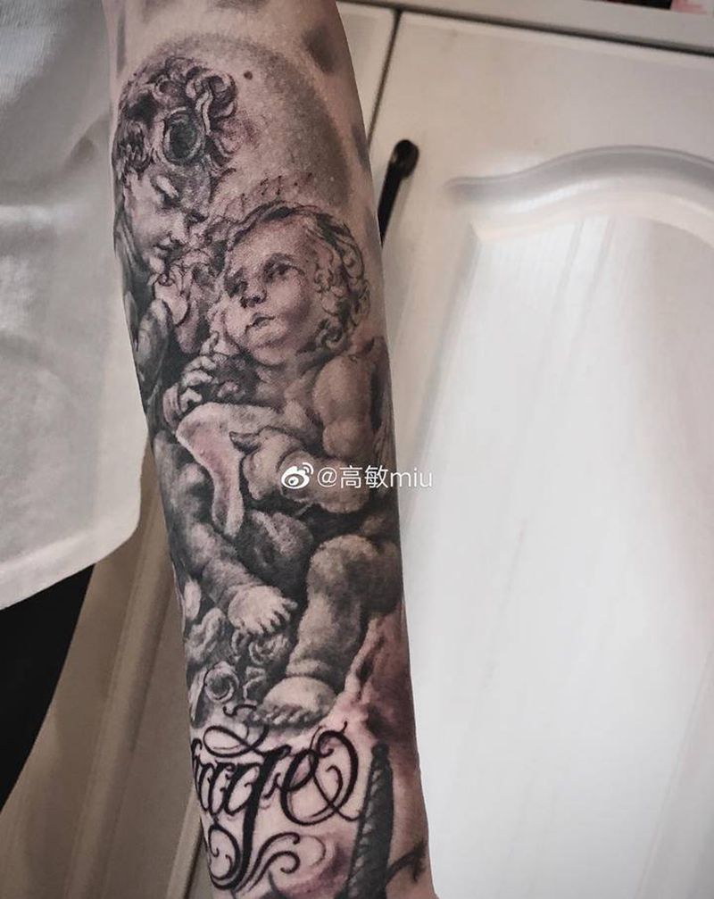 进度95%天使纹身图片_手臂欧美写实花体字纹身图案
