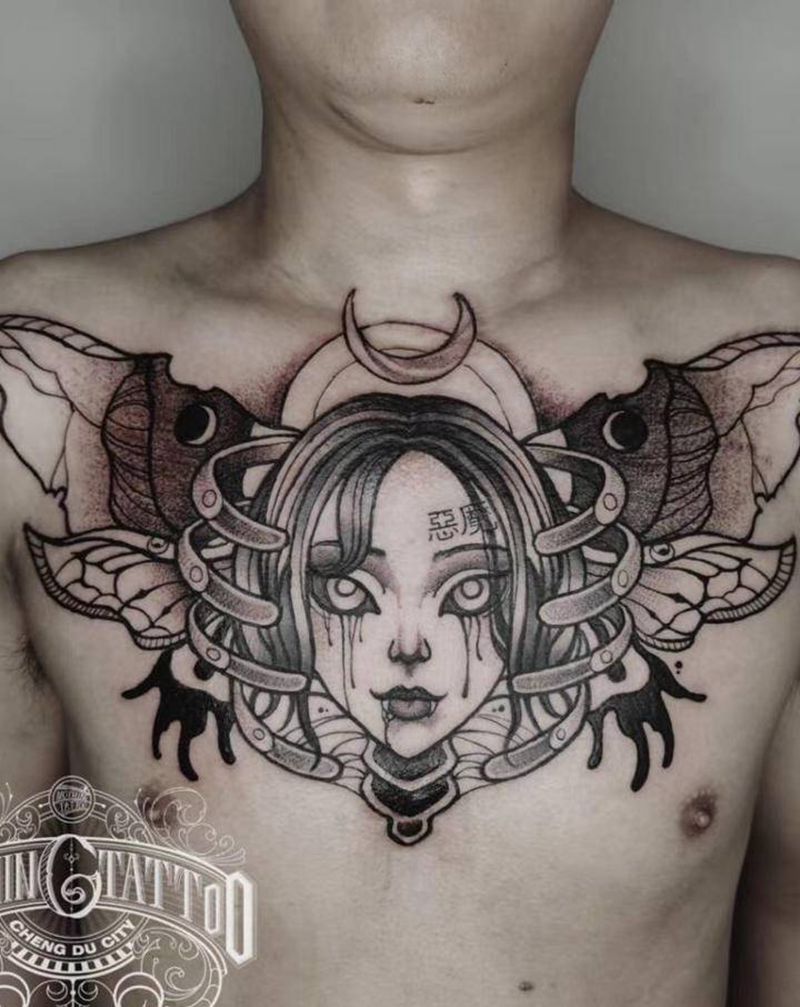 恶魔纹身图片_胸部点刺蝴蝶骨架人脸纹身图案
