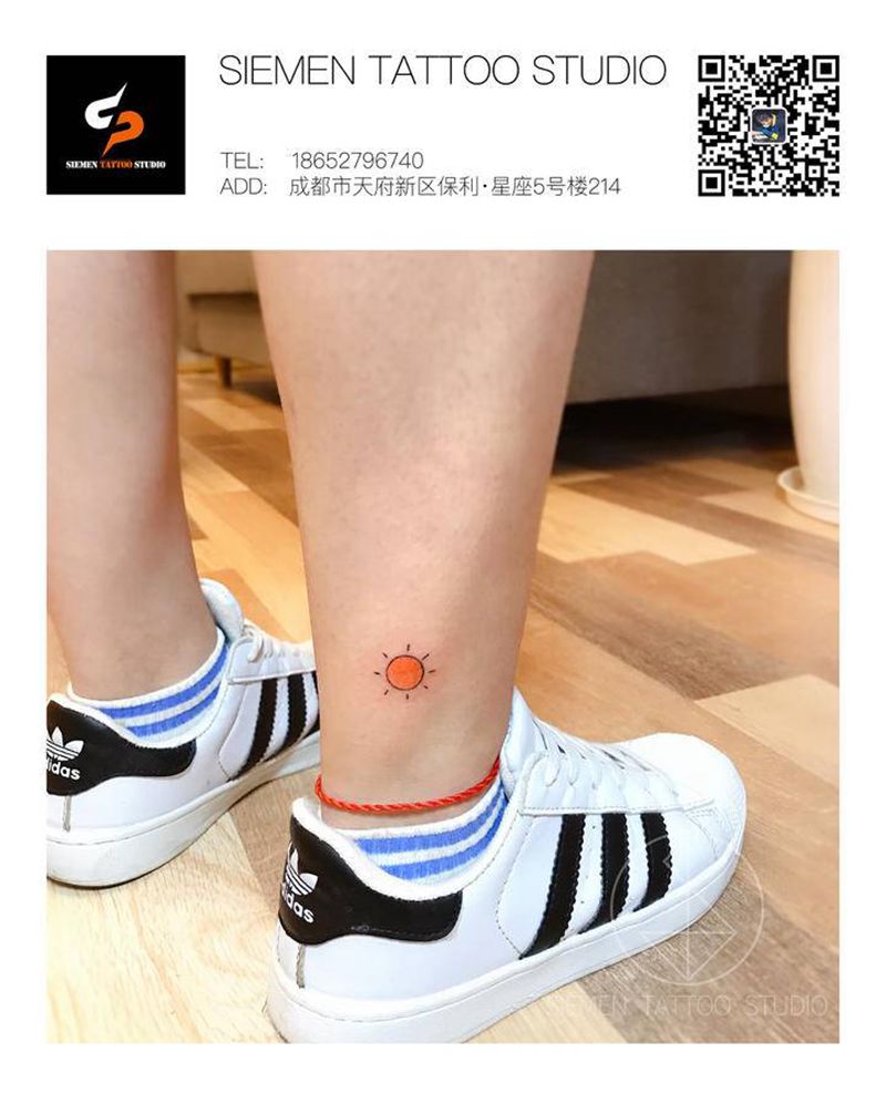 太阳纹身图片_腿部几何水彩太阳纹身图案
