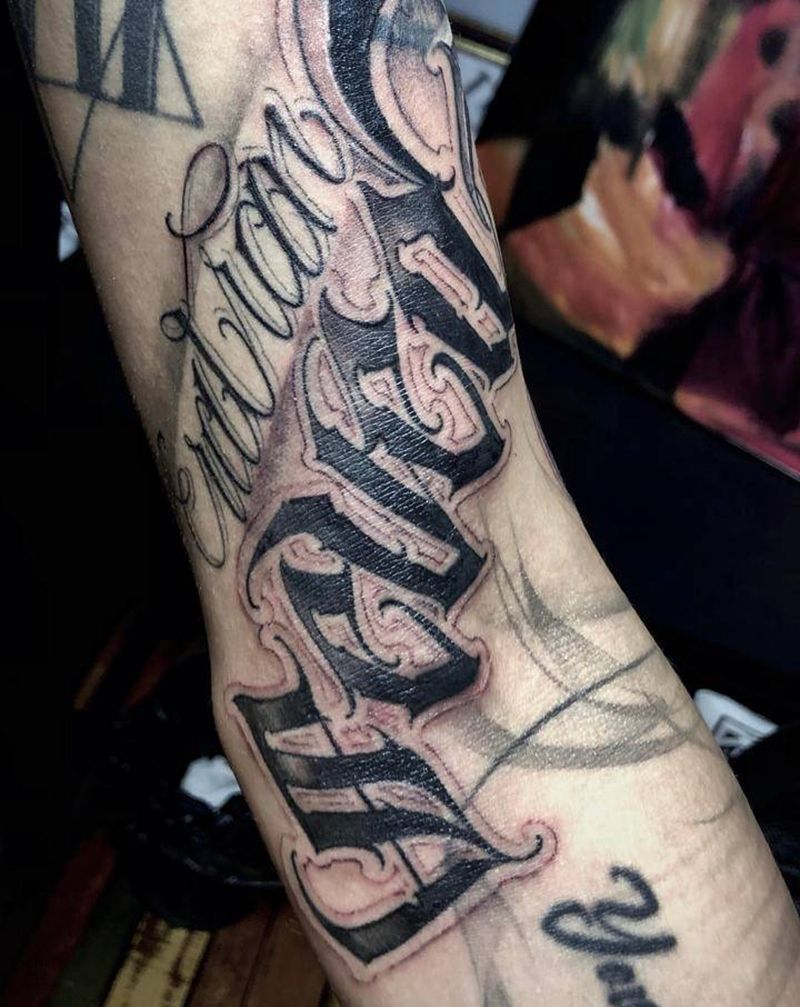 遮盖纹身纹身图片_手臂花体字欧美写实纹身图案