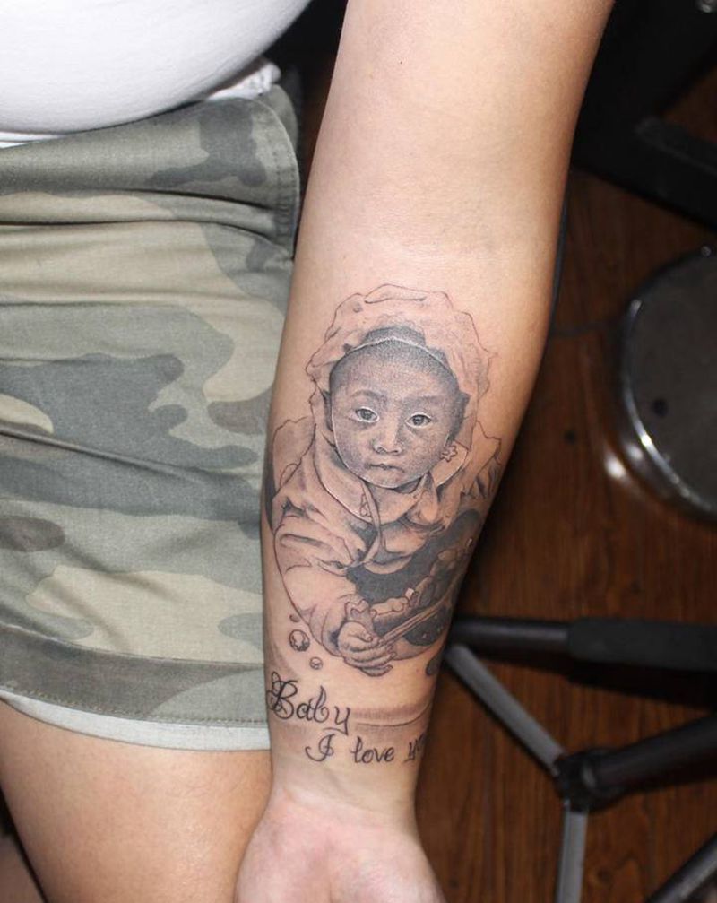 肖像纹身图片_手臂欧美写实点刺肖像人物纹身图案