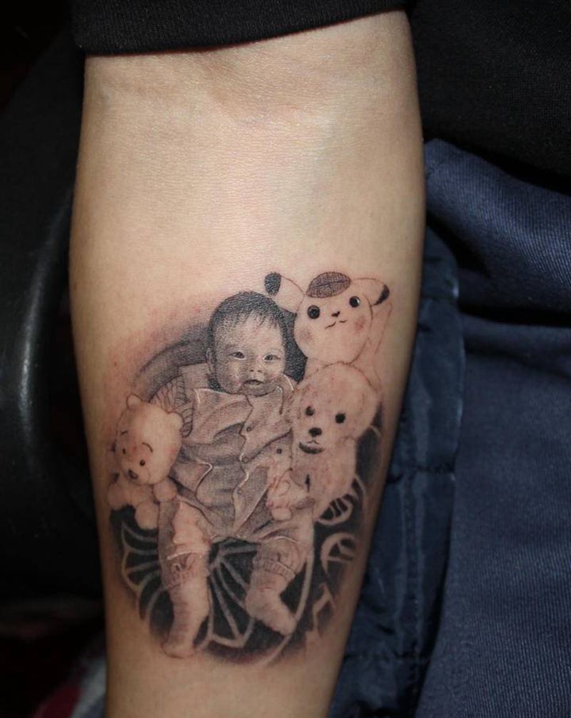 小朋友肖像纹身图片_手臂欧美写实图腾小朋友肖像小臂纹身图案
