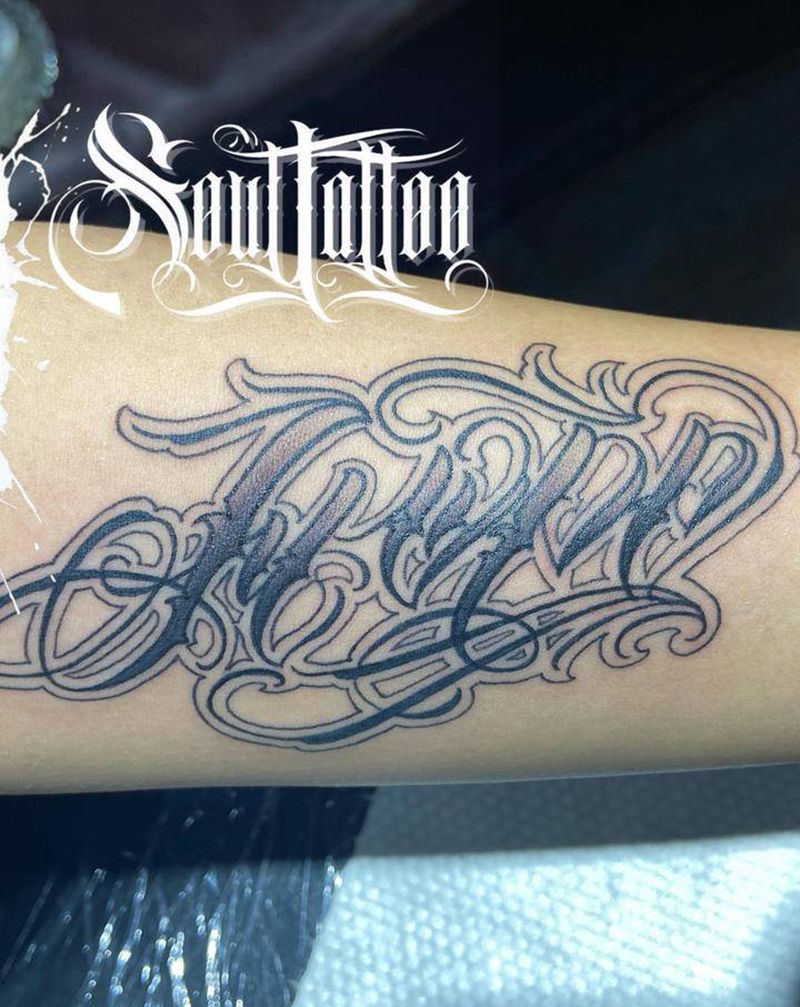 花体字纹身图片_手臂花体字纹身图案