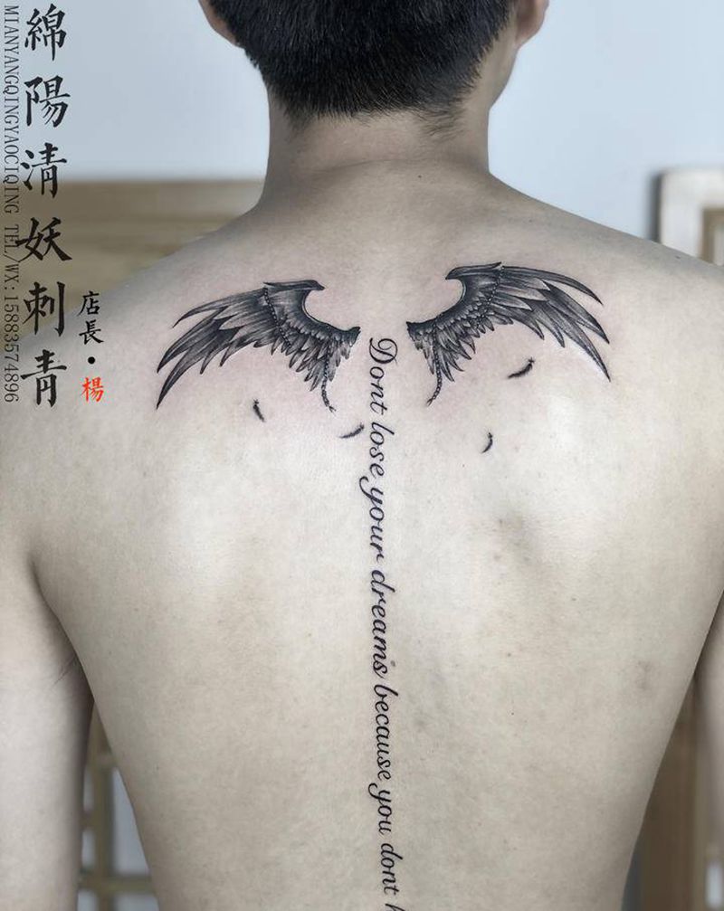 翅膀纹身图片_颈部肩部纹身图案