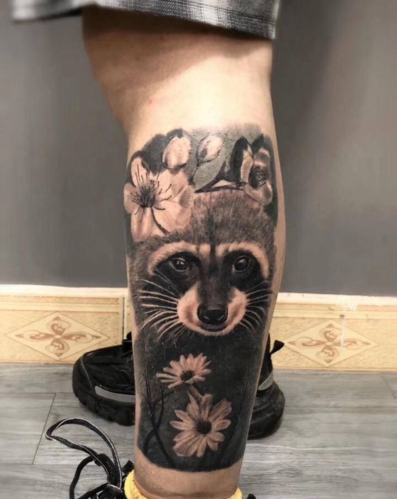 浣熊纹身图片_腿部欧美写实纹身图案