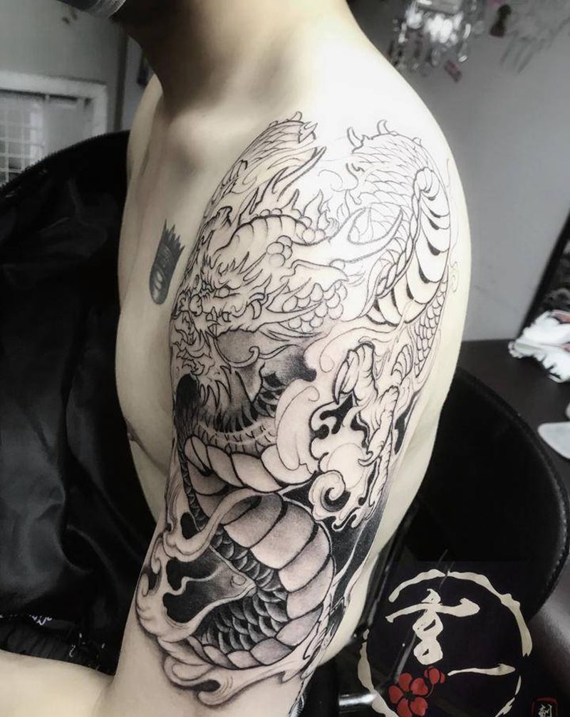 龙包臂未完待续纹身图片_手臂纹身图案
