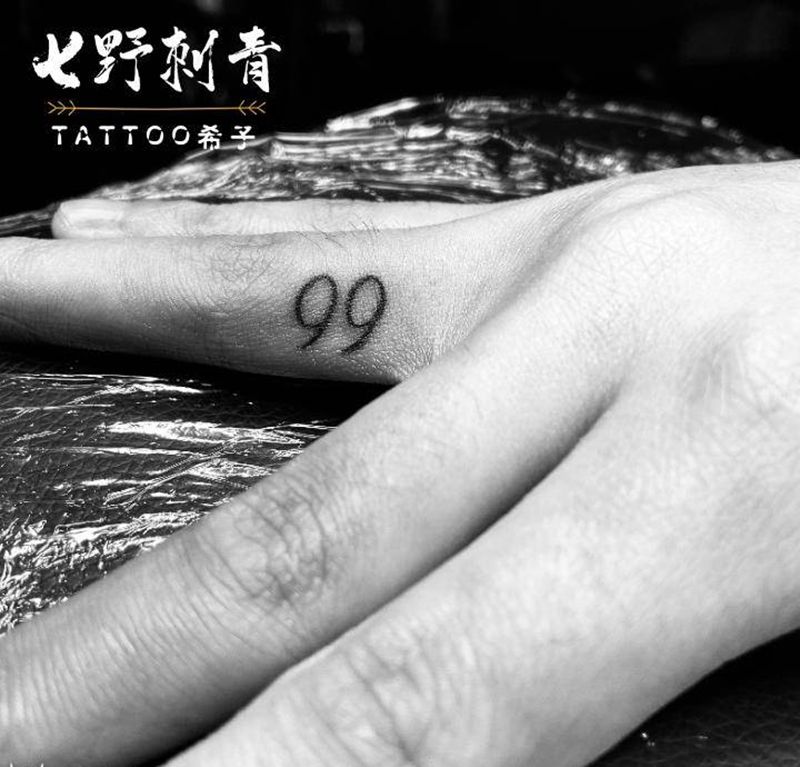 双9纹身图片_手部纹身图案