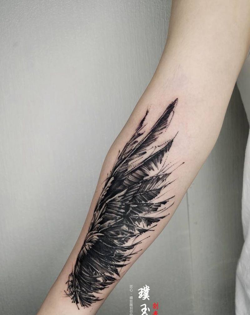 遮盖纹身图片_手臂点刺几何翅膀纹身图案