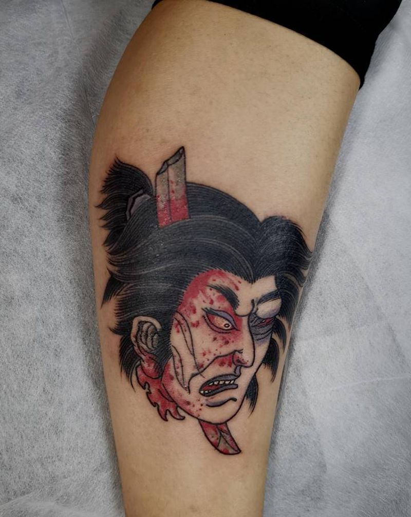 生首纹身图片_腿部老传统生首纹身图案