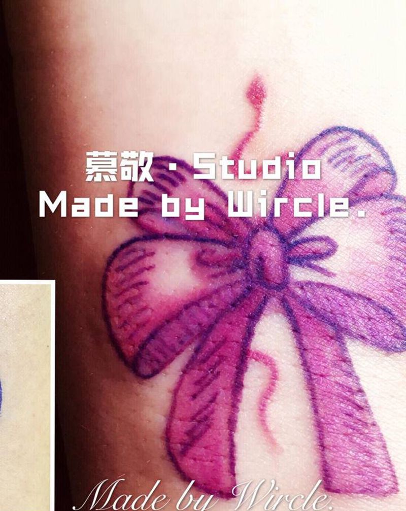 修改 / 蝴蝶结纹身图片_手部纹身图案