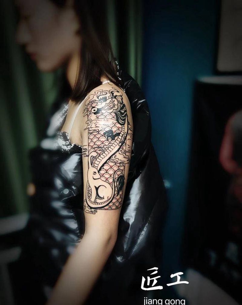 龙和兔纹身图片_手臂纹身图案