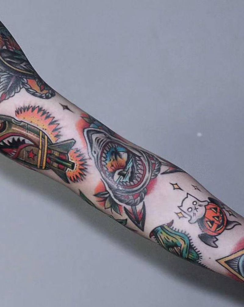 花臂拼接纹身图片_手臂New School纹身图案