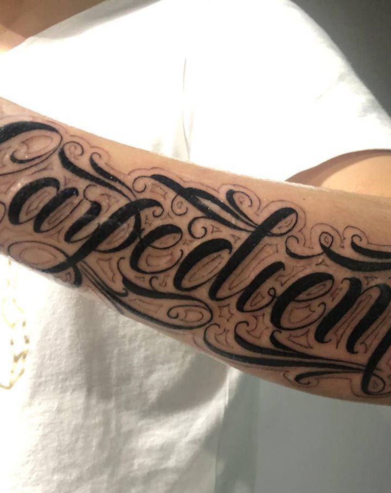 花体字纹身图片_手臂花体字纹身图案