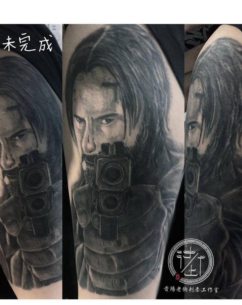 基努里维斯纹身图片_手臂欧美写实人物男头基努里维斯纹身图案