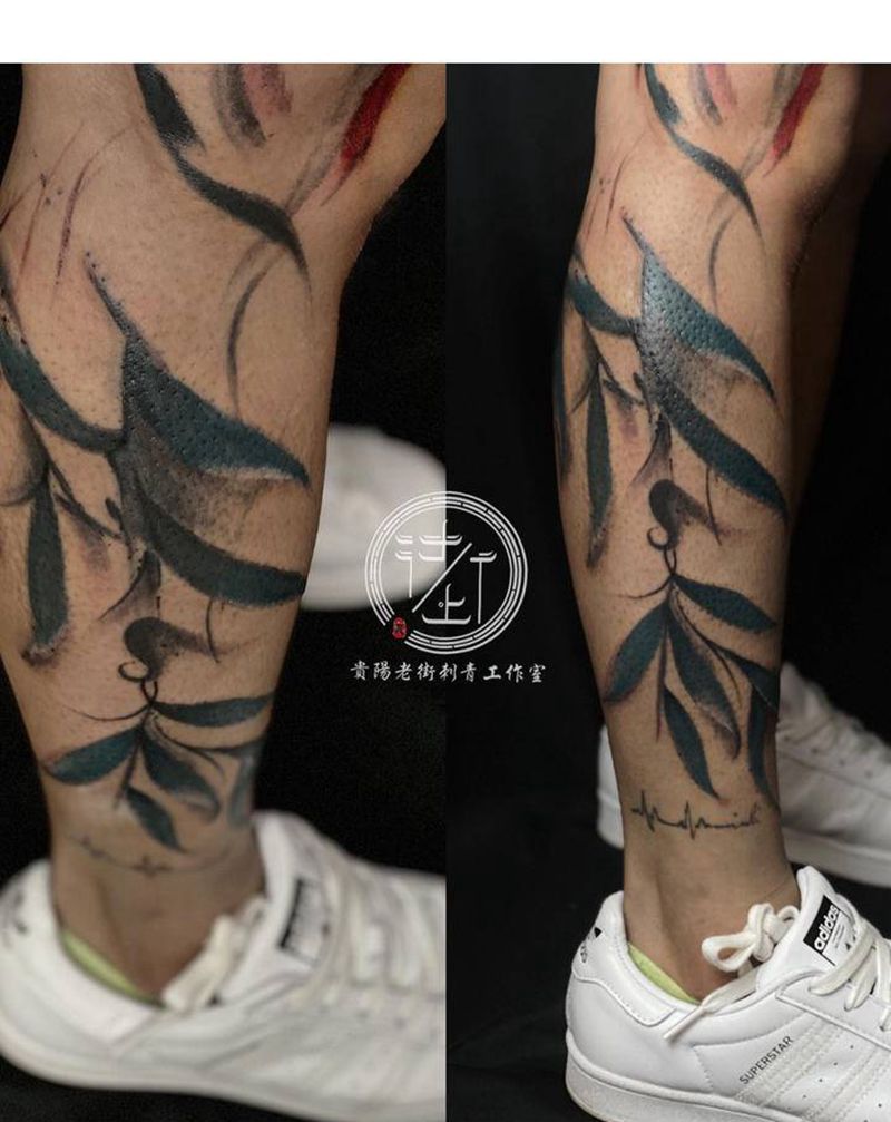 叶子纹身图片_腿部水墨叶子纹身图案