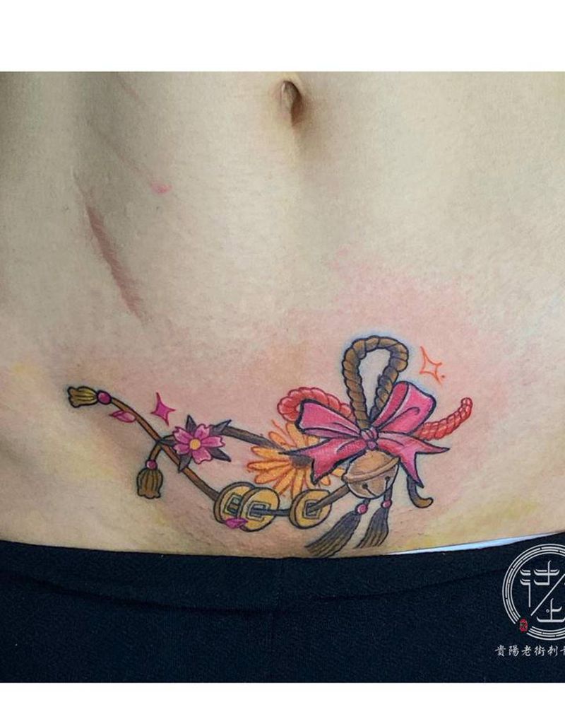 剖腹产作品纹身图片_腹部水彩铃铛纹身图案