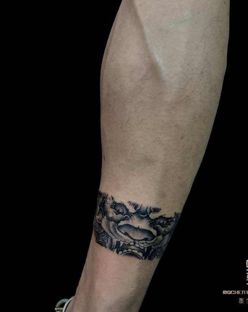 唐狮  腿环纹身图片_新传统唐狮臂环纹身图案